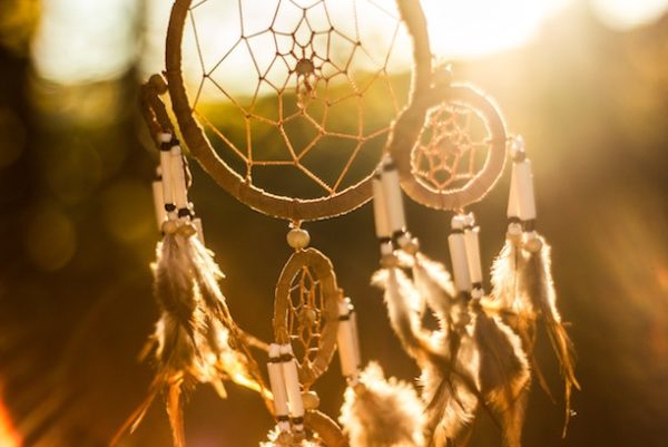 a Native American dream catcher at sunset