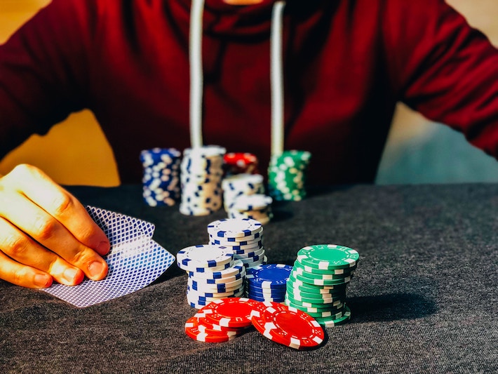 poker player with a colorful stack of chips, texas hold-em
