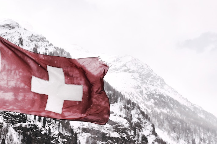 Swiss flag in the Swiss Alps